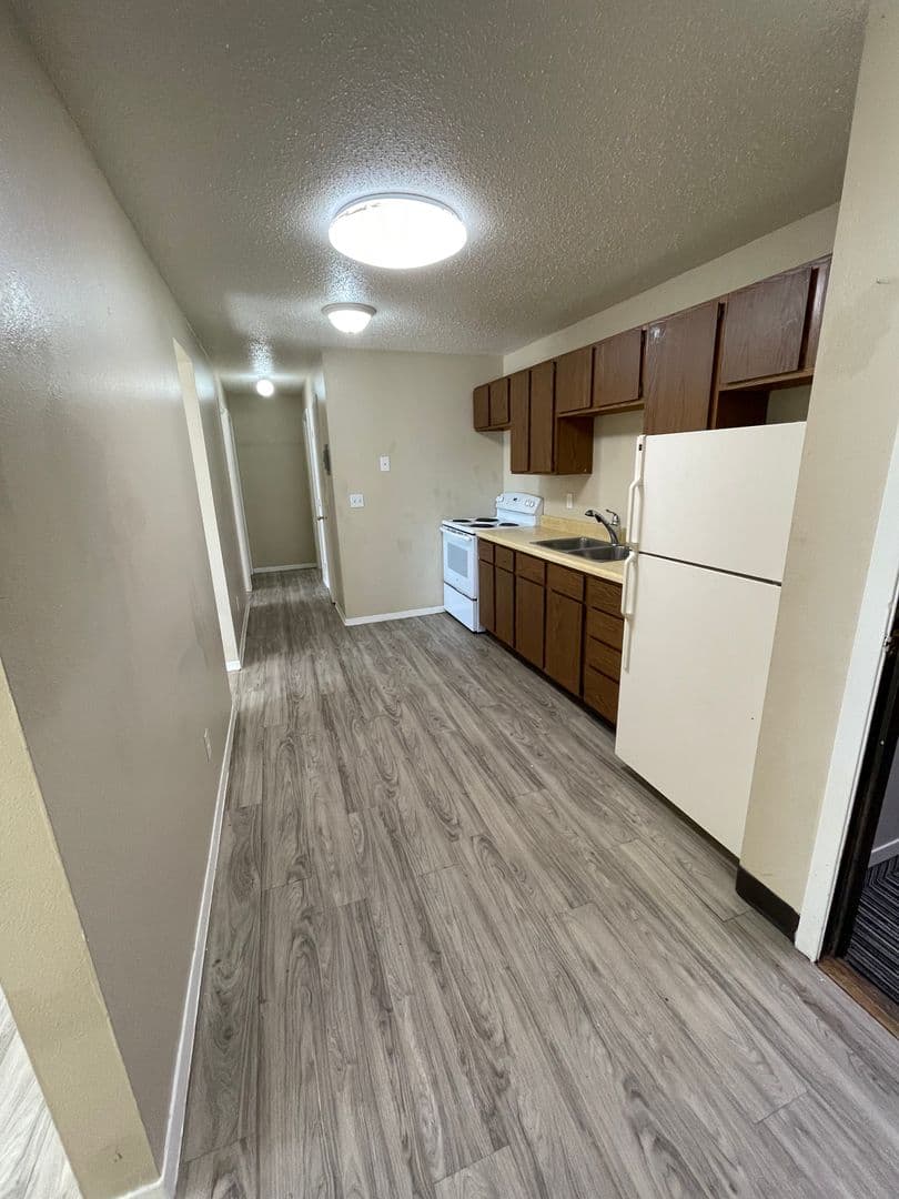 Williston Apartment: 2706, 2802, and 2820 17th Avenue W and 1608 26th Street West