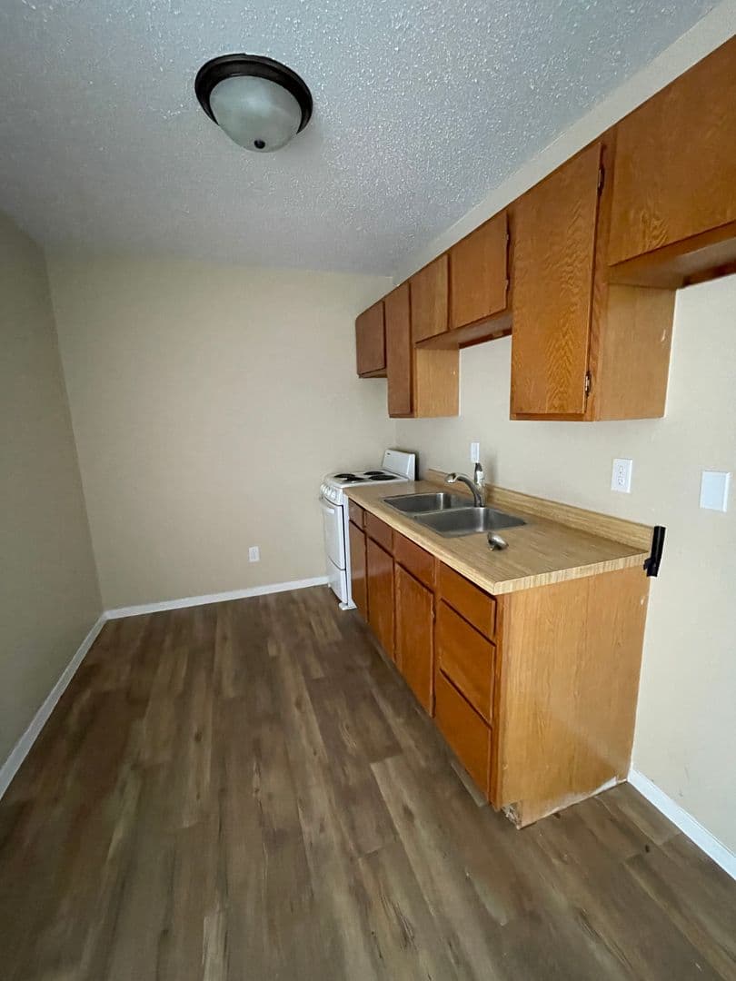 Williston Apartment: 2706, 2802, and 2820 17th Avenue W and 1608 26th Street West