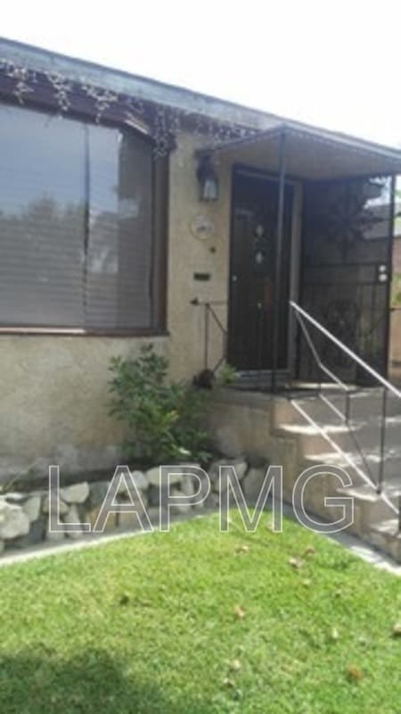 East Los Angeles House: 6165 E Olympic Blvd