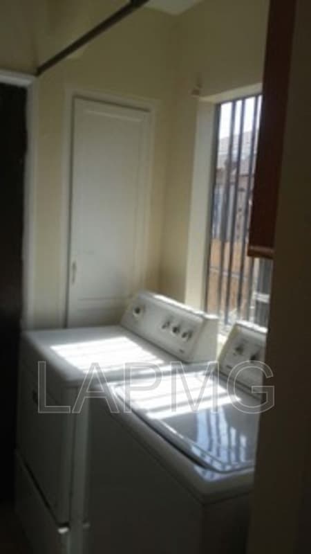 East Los Angeles House: 6165 E Olympic Blvd